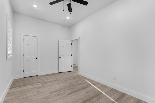 unfurnished bedroom with light wood-style flooring, recessed lighting, baseboards, and ceiling fan