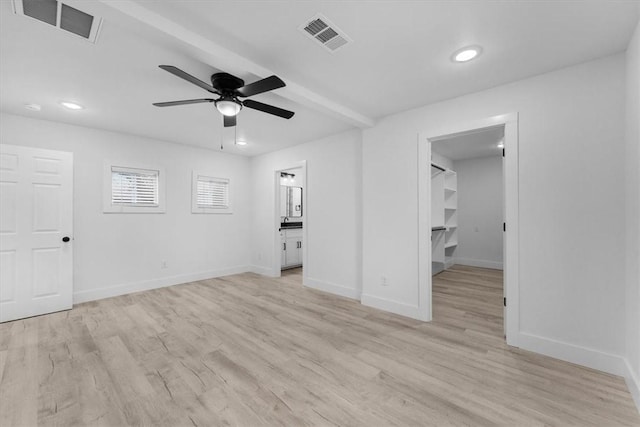 interior space with visible vents, light wood-style flooring, baseboards, and ceiling fan