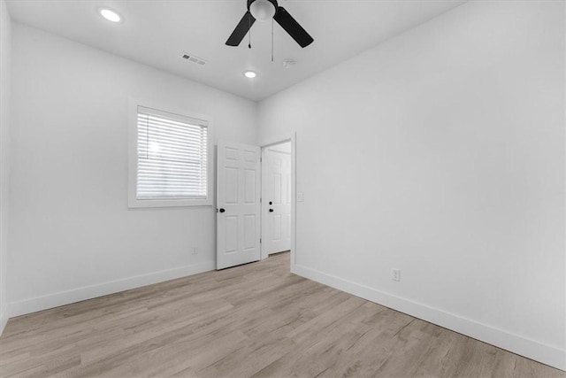 unfurnished room featuring a ceiling fan, recessed lighting, wood finished floors, and baseboards