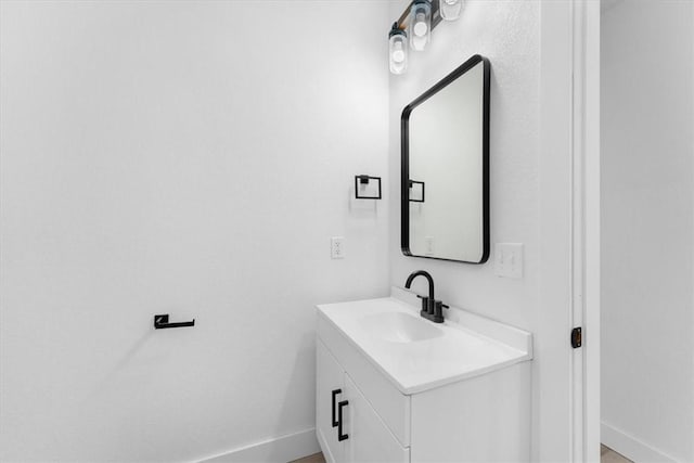 bathroom featuring vanity and baseboards