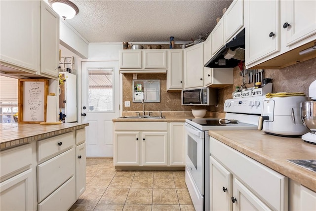 kitchen featuring backsplash, under cabinet range hood, electric range, white cabinets, and a sink