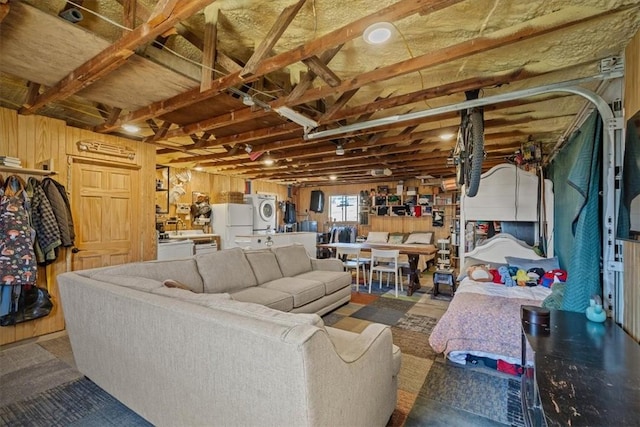 living area featuring stacked washer and dryer