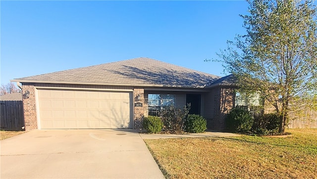 ranch-style house featuring concrete driveway, an attached garage, fence, and brick siding