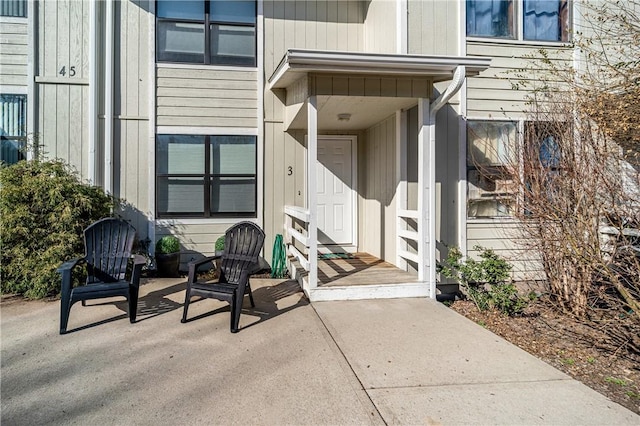 view of exterior entry featuring a patio