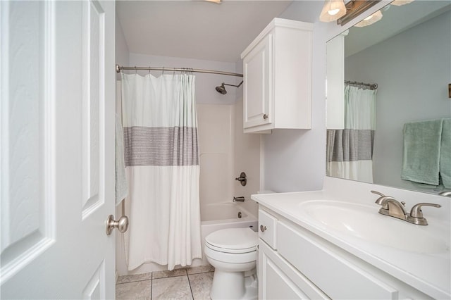 bathroom featuring vanity, tile patterned floors, toilet, and shower / bath combo with shower curtain