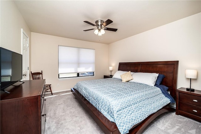 bedroom with carpet flooring, baseboards, and ceiling fan