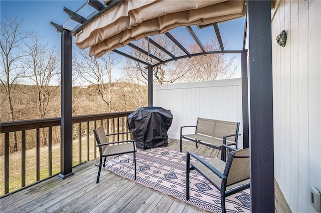 wooden terrace featuring visible vents and a grill