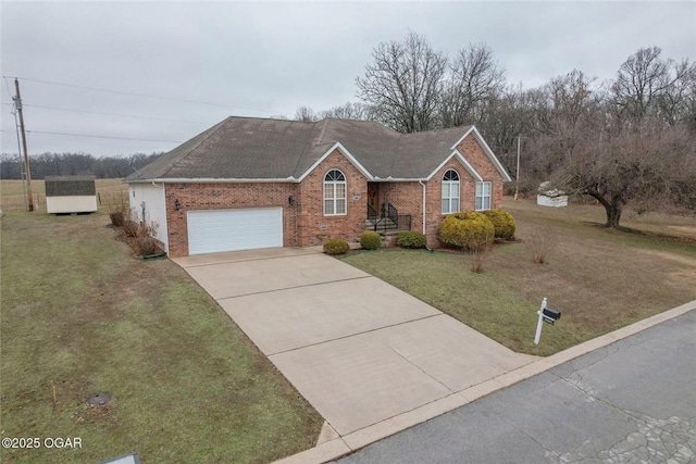 single story home featuring a front lawn, an attached garage, brick siding, and driveway