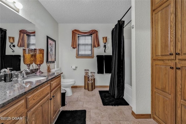 full bathroom with toilet, a shower with curtain, vanity, and a textured ceiling