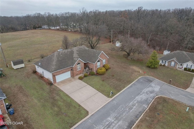 drone / aerial view with a view of trees