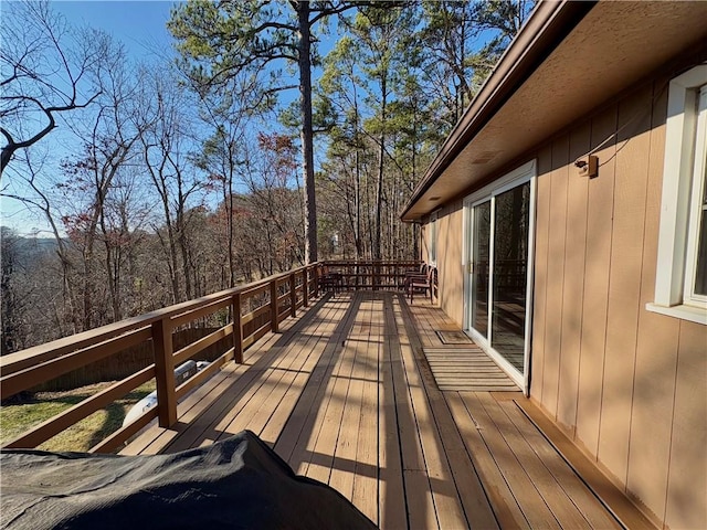 deck featuring a view of trees