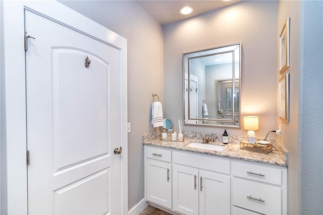 bathroom with vanity and recessed lighting