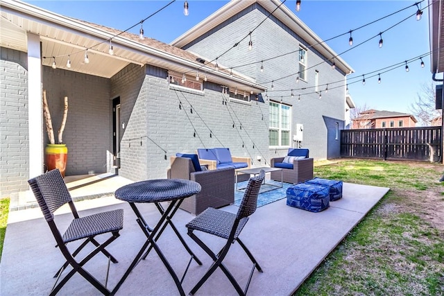 view of patio / terrace featuring outdoor lounge area and fence