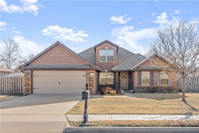 view of front of property featuring fence, driveway, roof with shingles, an attached garage, and a front lawn