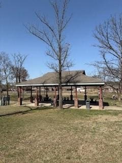 view of property's community with a gazebo and a lawn