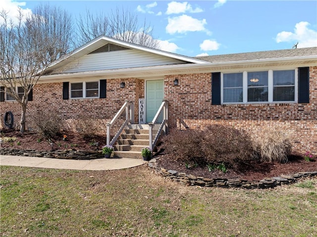 single story home with brick siding and crawl space