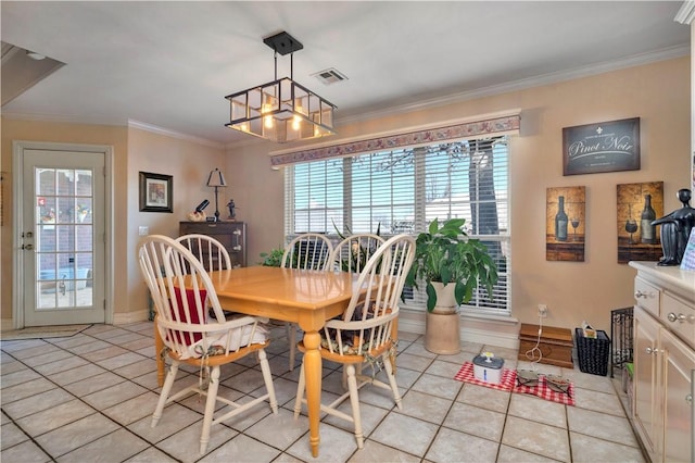 dining space featuring light tile patterned floors, visible vents, crown molding, and baseboards