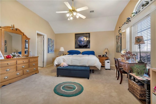 bedroom featuring visible vents, a ceiling fan, baseboards, lofted ceiling, and light colored carpet