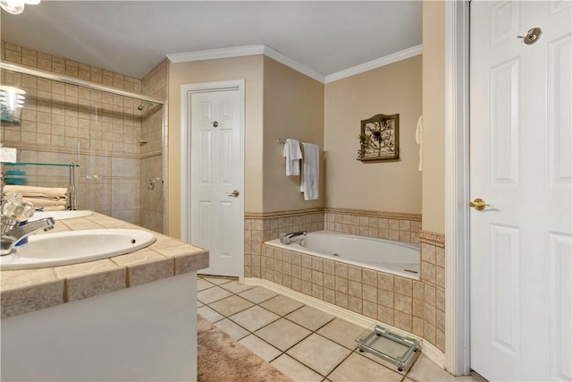 bathroom with a sink, a garden tub, ornamental molding, and tile patterned flooring