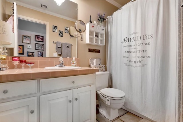 full bathroom with crown molding, toilet, decorative backsplash, tile patterned floors, and vanity