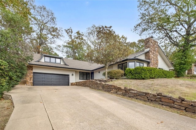 view of front of house with an attached garage and driveway