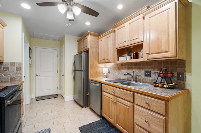 kitchen with a ceiling fan, light tile patterned flooring, a sink, stainless steel appliances, and tasteful backsplash