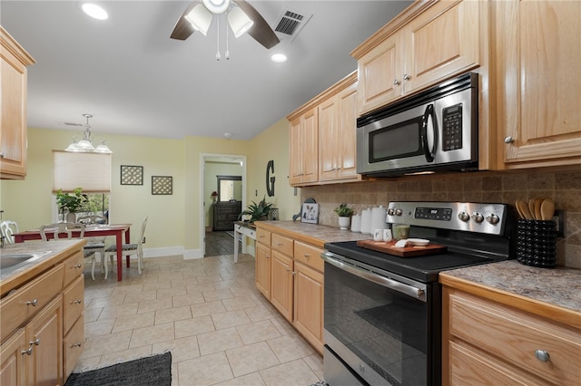 kitchen featuring visible vents, light brown cabinets, tasteful backsplash, appliances with stainless steel finishes, and ceiling fan