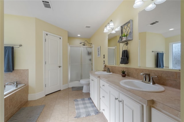 full bathroom featuring visible vents, double vanity, a stall shower, a sink, and tile patterned flooring