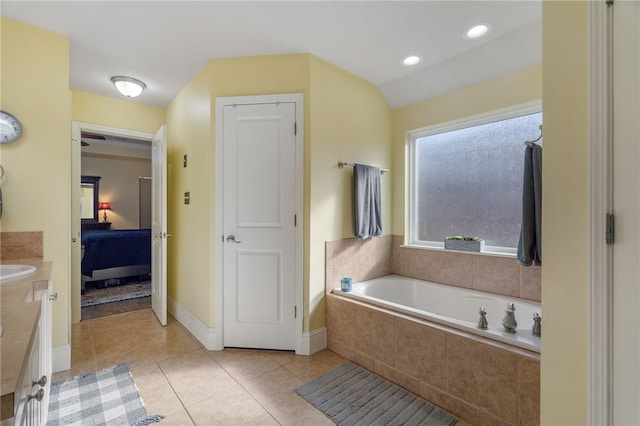 bathroom featuring tile patterned floors, a garden tub, ensuite bathroom, recessed lighting, and vanity