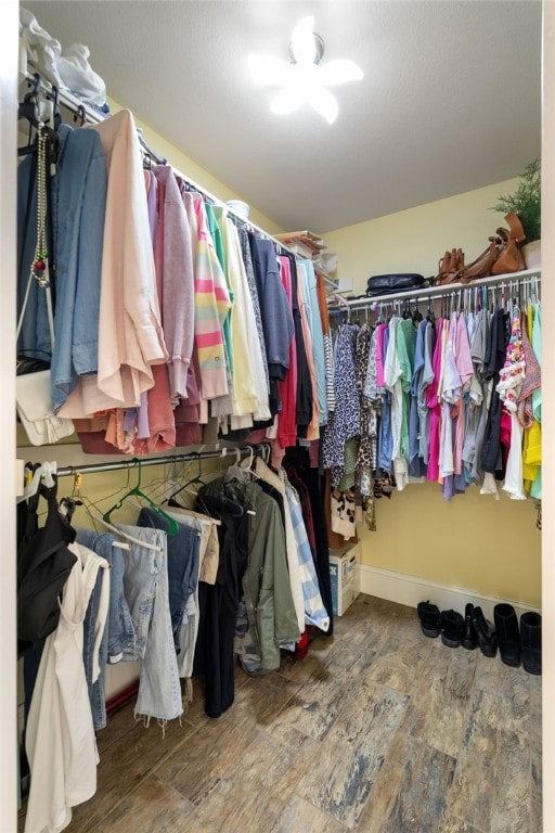 spacious closet with wood finished floors