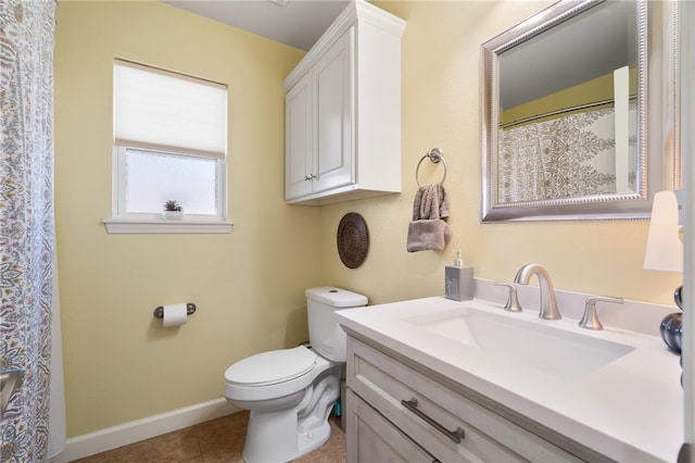 full bathroom with baseboards, toilet, vanity, and tile patterned flooring