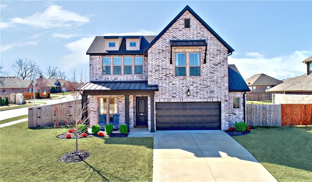 view of front of property with brick siding, an attached garage, driveway, a standing seam roof, and a porch