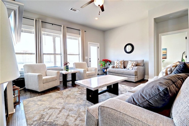 living area with visible vents, recessed lighting, a ceiling fan, and wood finished floors