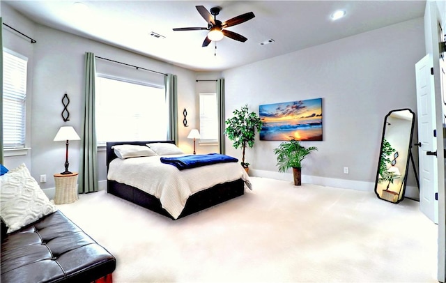 bedroom featuring a ceiling fan, carpet, visible vents, and baseboards