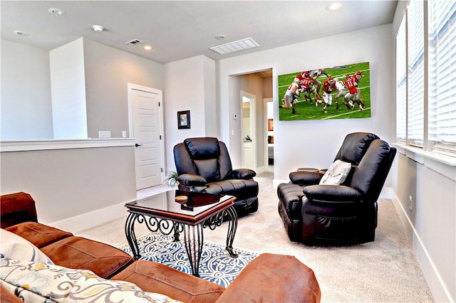 carpeted living room with recessed lighting, baseboards, and visible vents