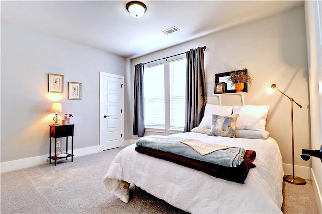 bedroom with carpet flooring, baseboards, and visible vents