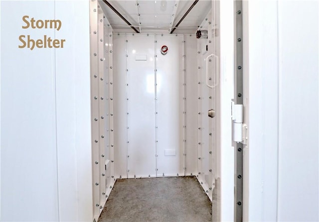 hallway featuring concrete flooring