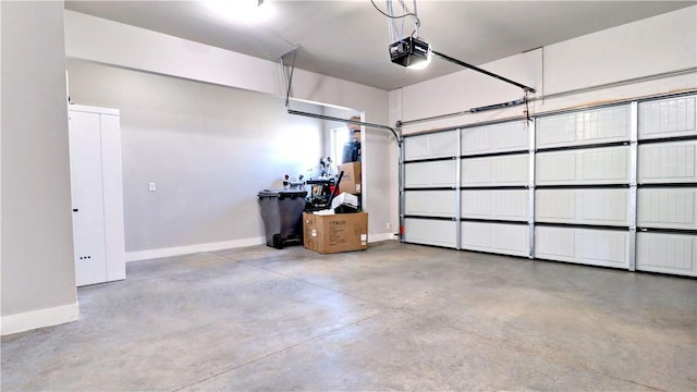 garage featuring baseboards and a garage door opener