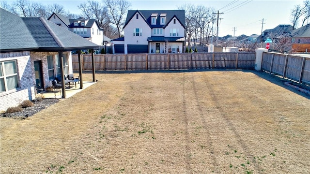 view of yard featuring a patio area and a fenced backyard