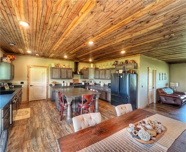 dining area with recessed lighting, wood ceiling, and dark wood-style flooring