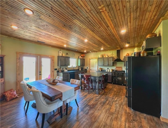 dining room featuring recessed lighting, dark wood finished floors, and wooden ceiling