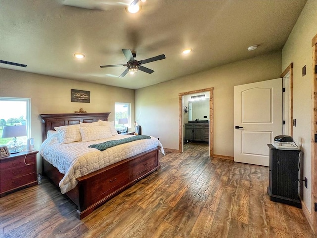 bedroom featuring visible vents, dark wood-type flooring, baseboards, recessed lighting, and ensuite bathroom