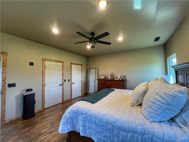 bedroom featuring baseboards, visible vents, recessed lighting, ceiling fan, and dark wood-type flooring