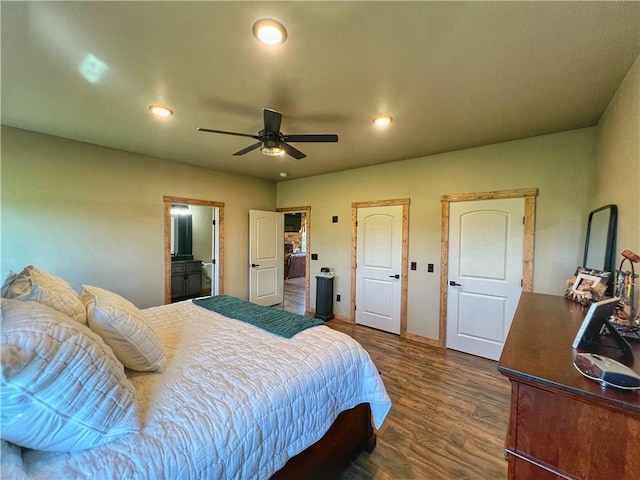 bedroom with a ceiling fan, ensuite bath, recessed lighting, and dark wood-style flooring