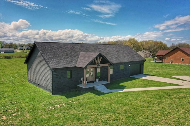 view of front of home featuring a front lawn, roof with shingles, concrete driveway, and an attached garage