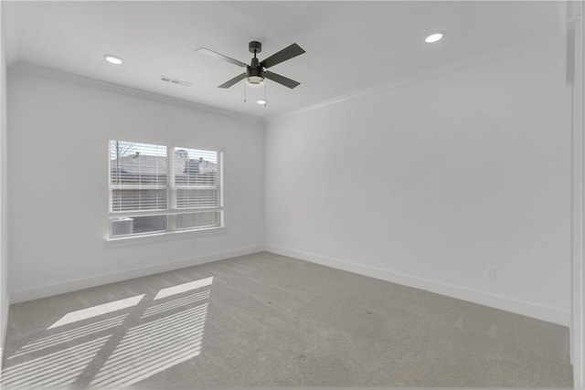 carpeted empty room featuring ceiling fan, baseboards, ornamental molding, and recessed lighting