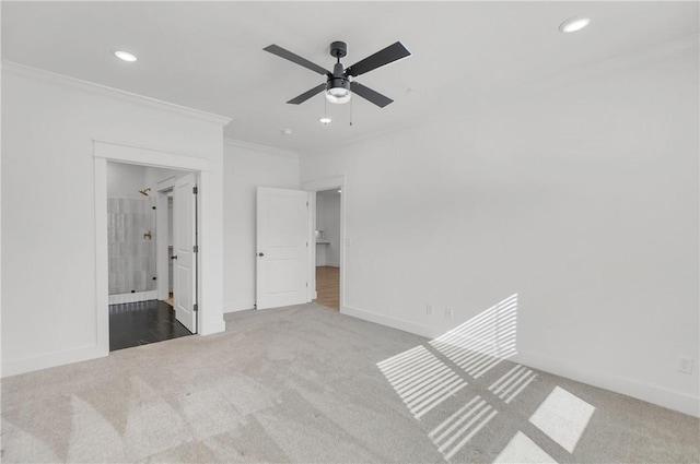 unfurnished bedroom featuring recessed lighting, carpet, and crown molding