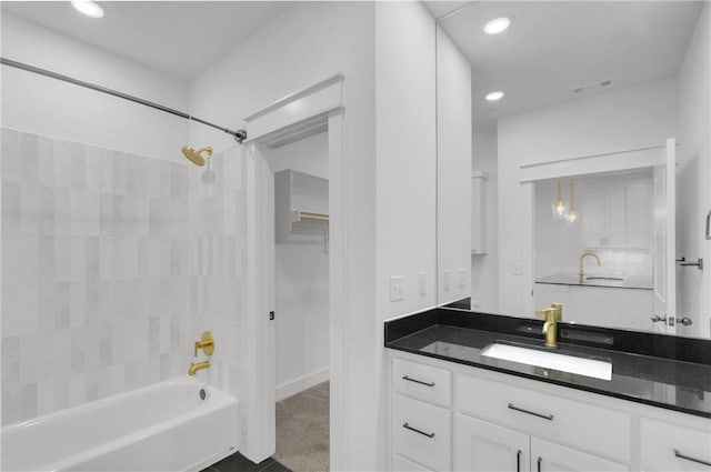 bathroom with visible vents, recessed lighting, vanity, and bathing tub / shower combination