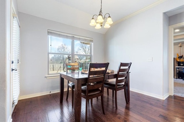 dining space featuring dark wood-style floors, baseboards, an inviting chandelier, and vaulted ceiling