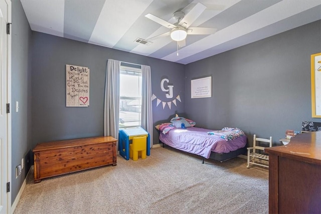 bedroom featuring visible vents, baseboards, a ceiling fan, and carpet floors